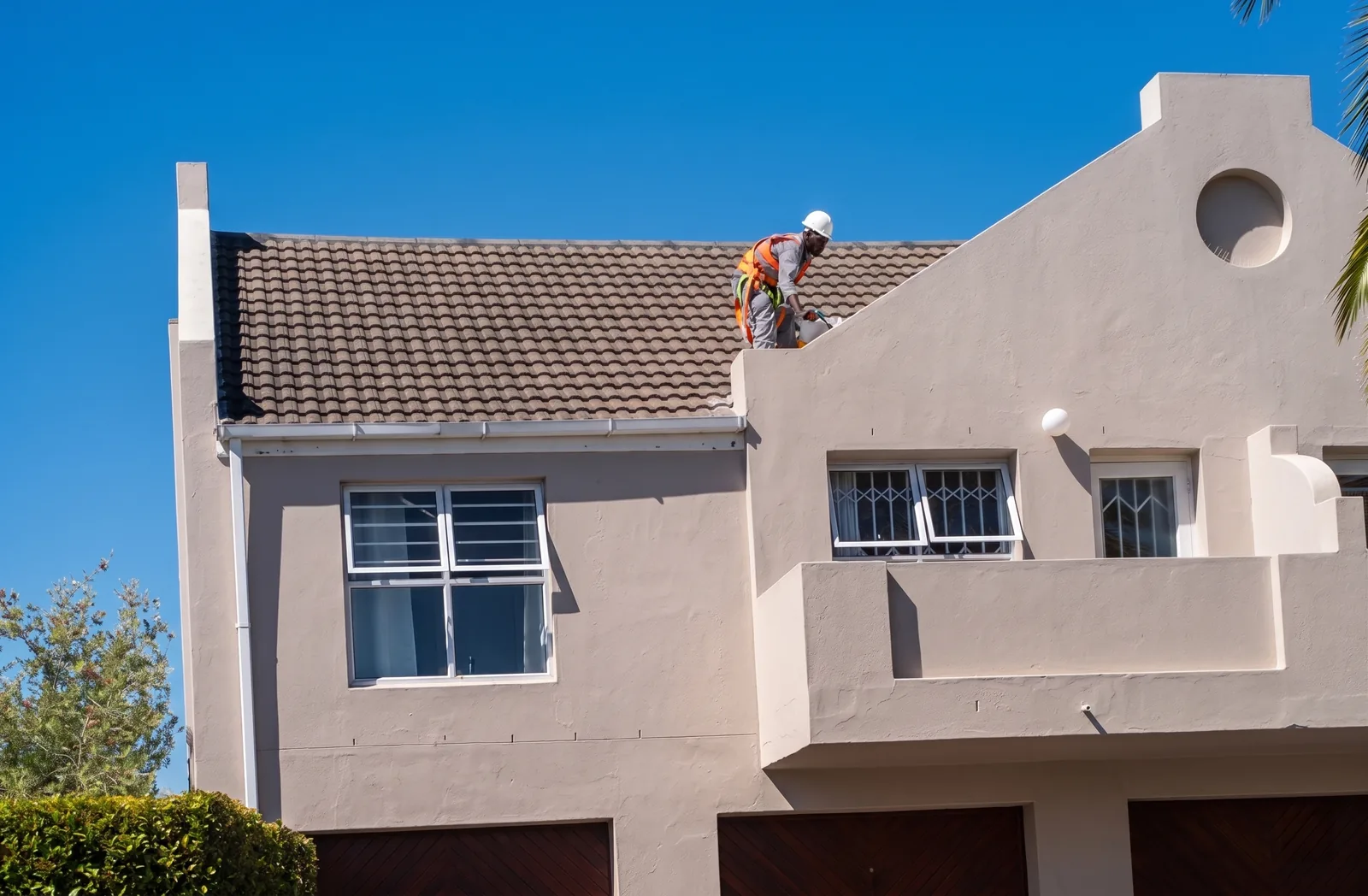 CBM worker sealing the roof and gable at Fairmount Close in Edgemead