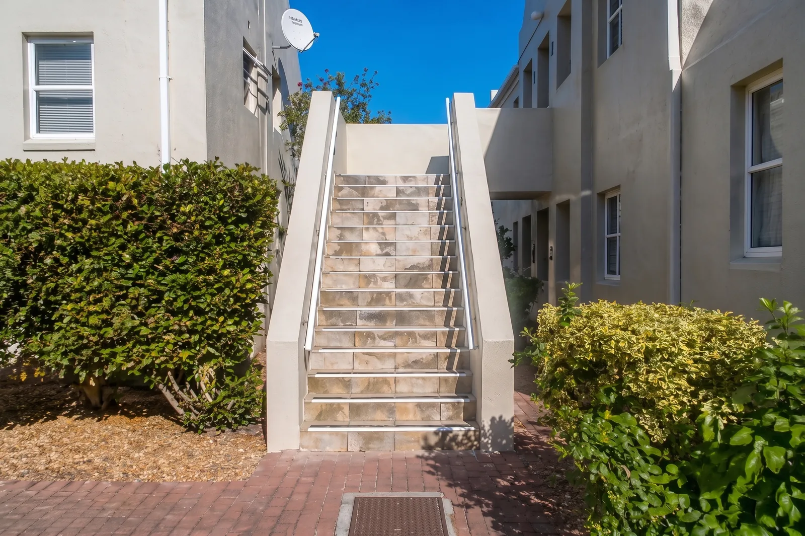 Common-area steps at Fairmount Close after restoration in Edgemead