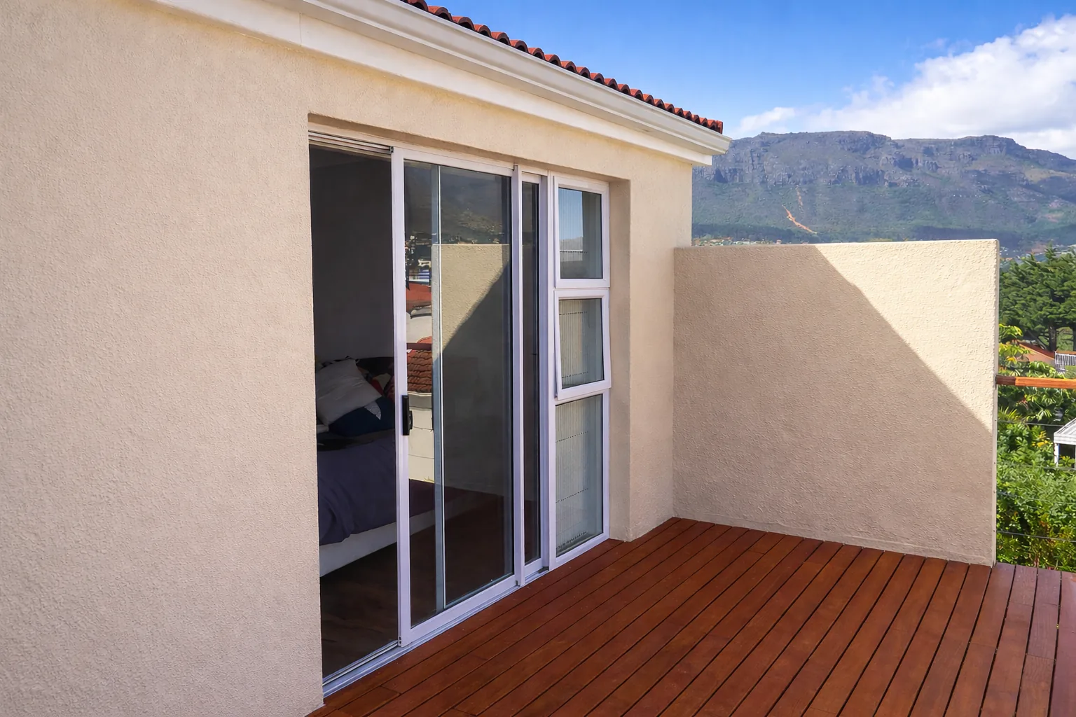 Renovated exterior and sliding doors onto the deck in Hout Bay