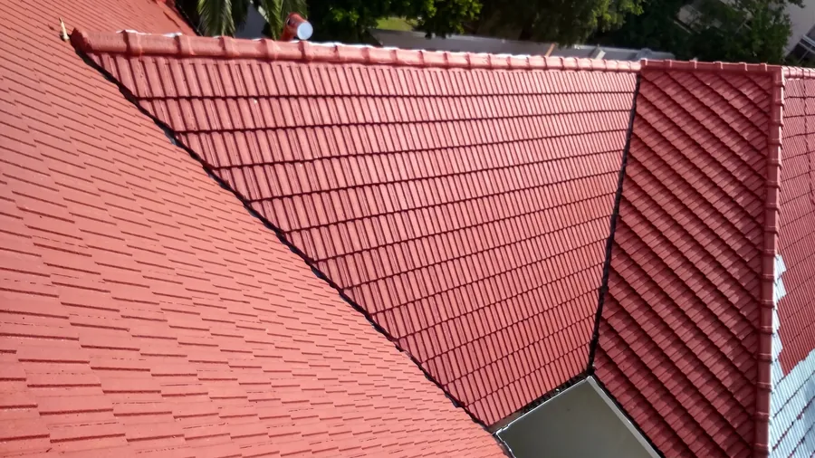 Rejuvenated tile roof in Rondebosch, ridging and valley gutters repaired, cleaned and repainted