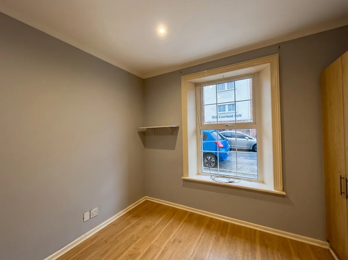 Repainted interior room after damp repairs in Rosebank